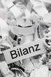 Papierschnitzel Stichwort Bilanz