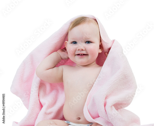Photo: Adorable happy baby girl in towel Adorable happy baby girl in towel