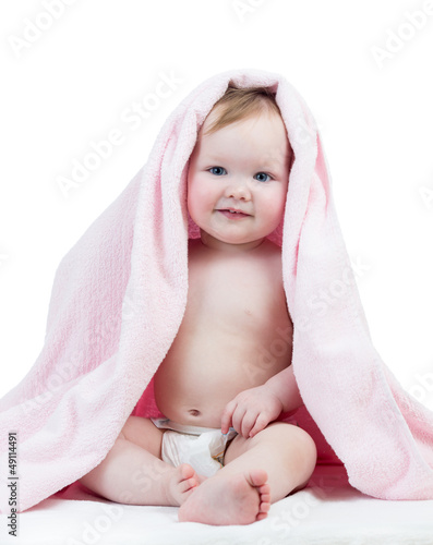 Photo: Adorable happy baby girl in towel Adorable happy baby girl in towel
