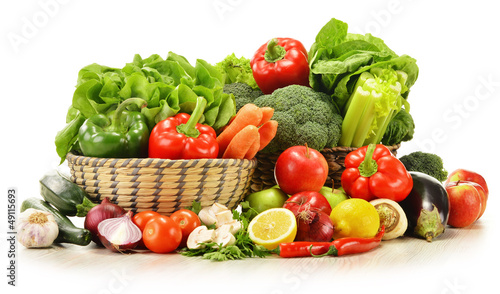 Photo: raw vegetables in wicker basket isolated on white raw vegetables in wicker basket isolated on white