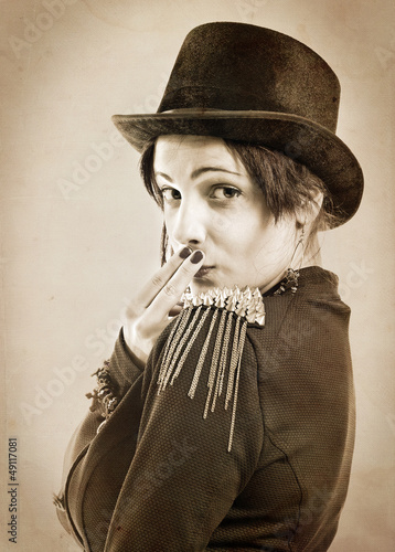 Photo: The actress of a cabaret imitates Charlie Chaplin The actress of a cabaret imitates Charlie Chaplin