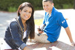 Girl and boy students relaxing outdoors