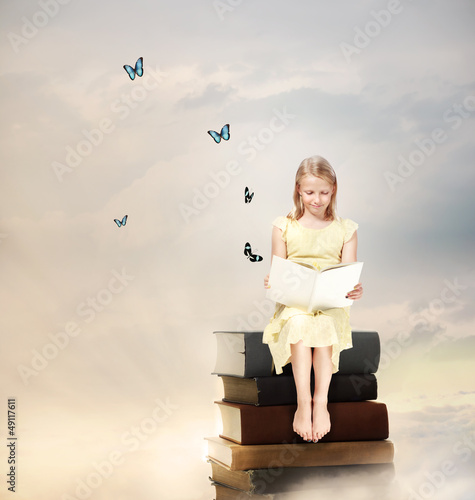 Photo: Little Blonde Girl Reading a Book Little Blonde Girl Reading a Book