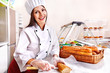 Female chef holding  food.
