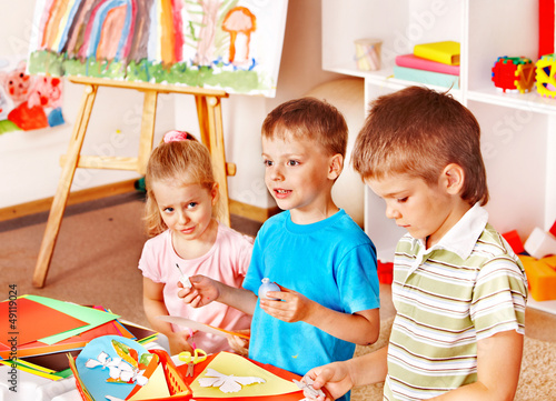 Photo: Child cutting out scissors paper. Child cutting out scissors paper.