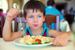 Cute little boy enjoying food