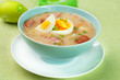 White borscht with eggs and white sausage.Polish easter soup