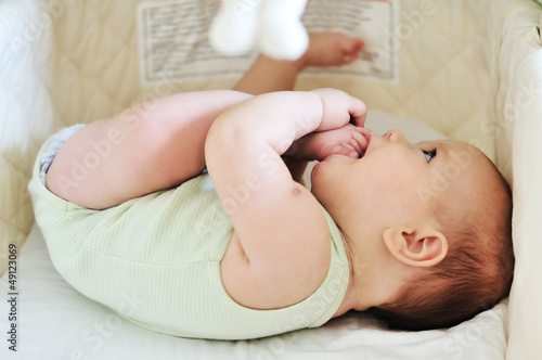 Photo: baby with feet in mouth baby with feet in mouth