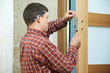 carpenter at door lock installation