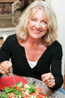 Photo: Healthy Middle-aged Woman Eating Salad Healthy Middle-aged Woman Eating Salad
