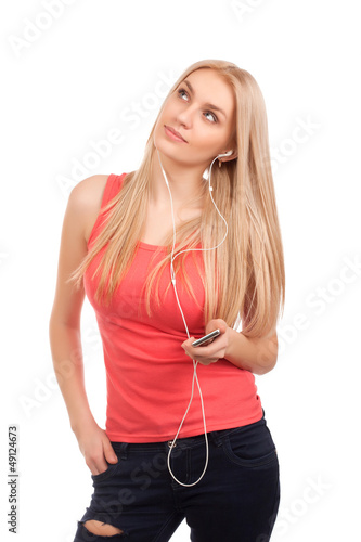 Photo: Blond teenage girl listen music and dreaming Blond teenage girl listen music and dreaming