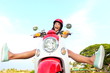 Funny happy free woman on scooter