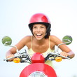 Excited woman on scooter happy