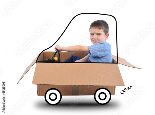 Photo: Boy Driving Box Car on White Boy Driving Box Car on White