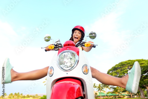 Photo: Funny happy free woman on scooter Funny happy free woman on scooter