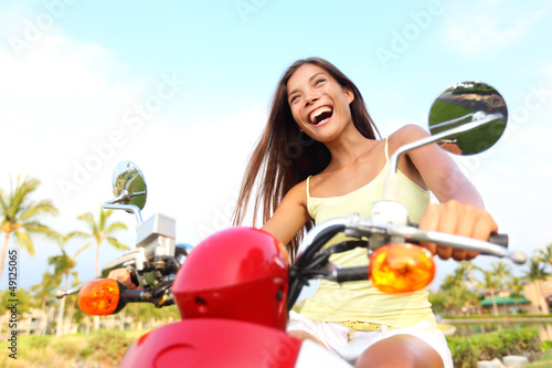 Photo: Happy free asian woman on scooter Happy free asian woman on scooter