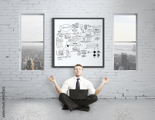 Photo: businessman meditating businessman meditating