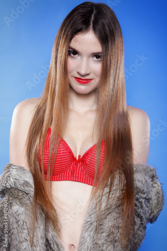 Photo: sexy woman in fur coat and red bra sexy woman in fur coat and red bra