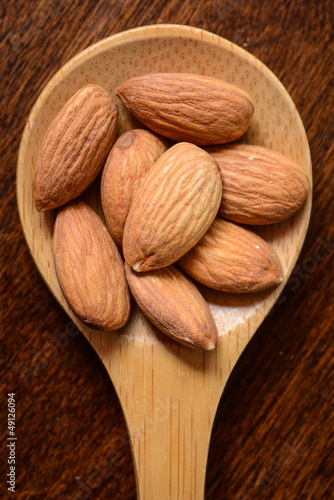 Photo: Almonds in a Wooden Spoon Close Up Almonds in a Wooden Spoon Close Up