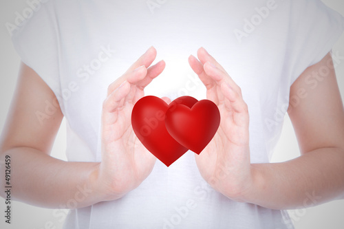 Photo: Heart on woman hands over body Heart on woman hands over body