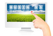 Hand pushing Business word on monitor screen.