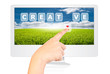 Hand pushing Creative word on monitor screen.