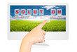 Hand pushing Solution word on monitor screen.