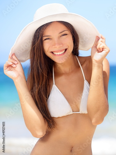 Photo: Happy young woman beach portrait Happy young woman beach portrait