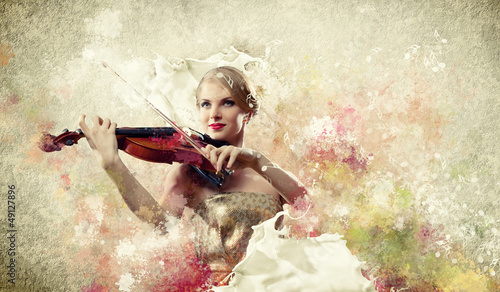 Photo: Gorgeous woman playing on violin Gorgeous woman playing on violin