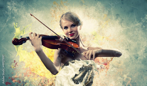Photo: Gorgeous woman playing on violin Gorgeous woman playing on violin