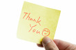 hand showing a post-it to thank you