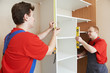 Wardrobe joiners at installation work