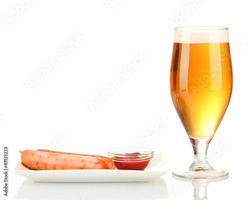 Photo: Beer and grilled sausages isolated on white Beer and grilled sausages isolated on white