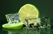 Ice cubes with lime on darck green background