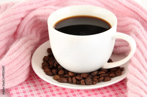 Photo: cup of coffee with scarf close-up cup of coffee with scarf close-up