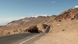 Sport car on Artists Drive road at Death Valley NP. USA.