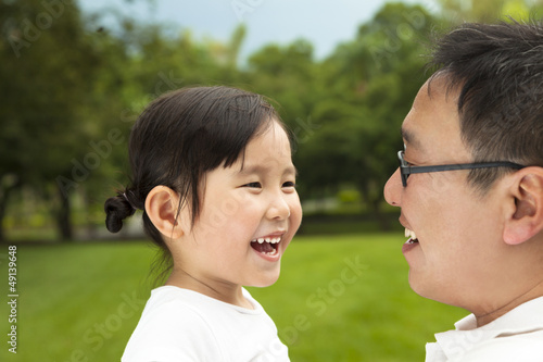 Photo: happy asian little girl with her father happy asian little girl with her father