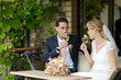 Bride and groom drinking wine