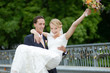 Groom carrying his bride