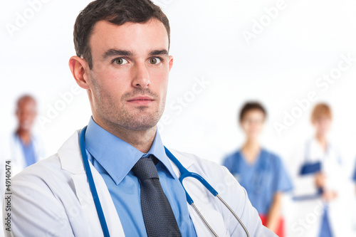 Photo: Doctor in front of his medical team Doctor in front of his medical team