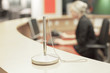 Foto: Blond woman working at help desk Blond woman working at help desk