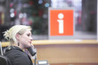 Photo: Blond woman working at help desk Blond woman working at help desk