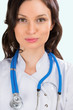 Closeup portrait of adult female doctor with kind look at hospit