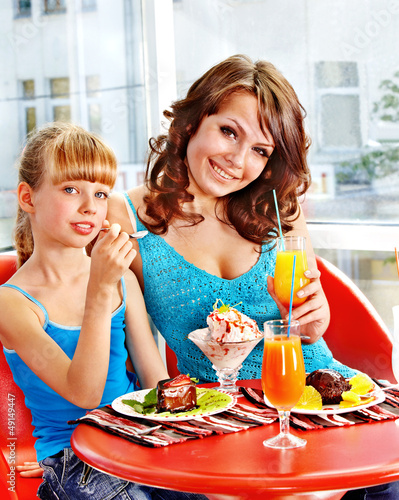 Photo: Mother and daughter in restaurant. Mother and daughter in restaurant.