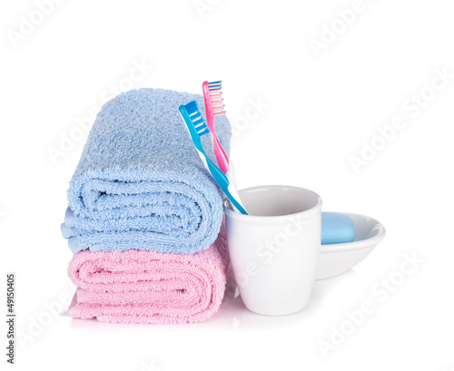 Photo: Toothbrushes, soap and two towels Toothbrushes, soap and two towels