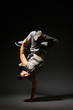 hip-hop dancer standing on one hand