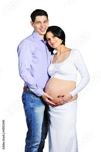 Photo: Young pregnant woman with her husband isolated on white Young pregnant woman with her husband isolated on white