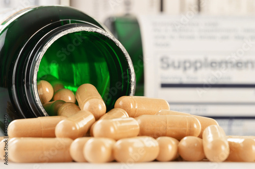 Photo: Composition with dietary supplement capsules. Drug pills Composition with dietary supplement capsules. Drug pills