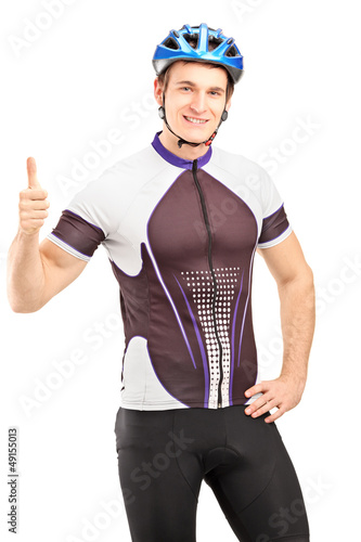 Photo: Handsome male cyclist giving a thumb up Handsome male cyclist giving a thumb up