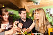 Young people eating in Thai restaurant